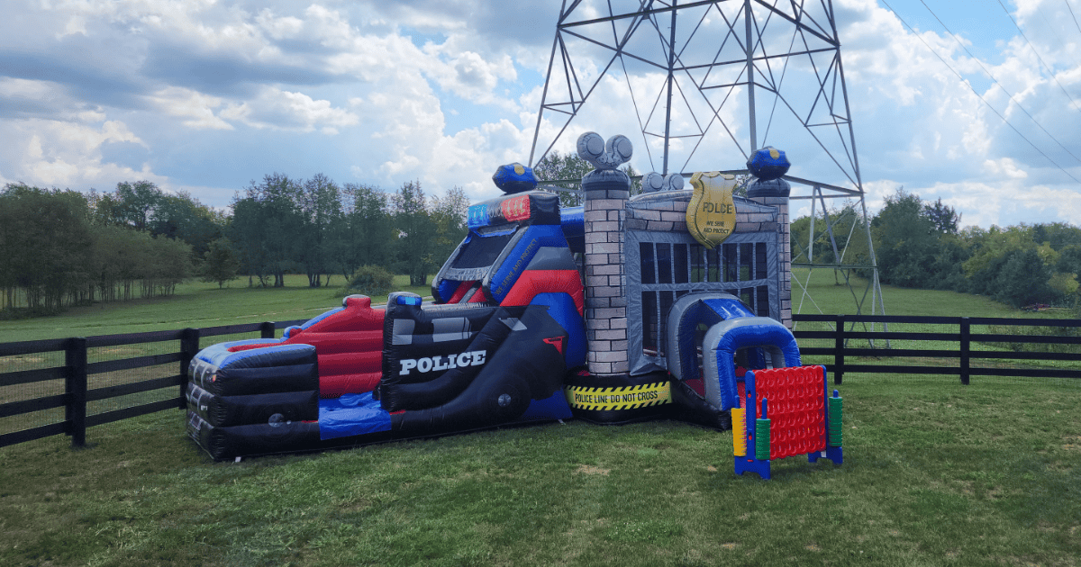 Police Cruiser Bounce House with Giant Connect 4, a perfect addition to the Ultimate Backyard Party for Boys for an action-packed first responder theme in Central Kentucky Party Rentals.