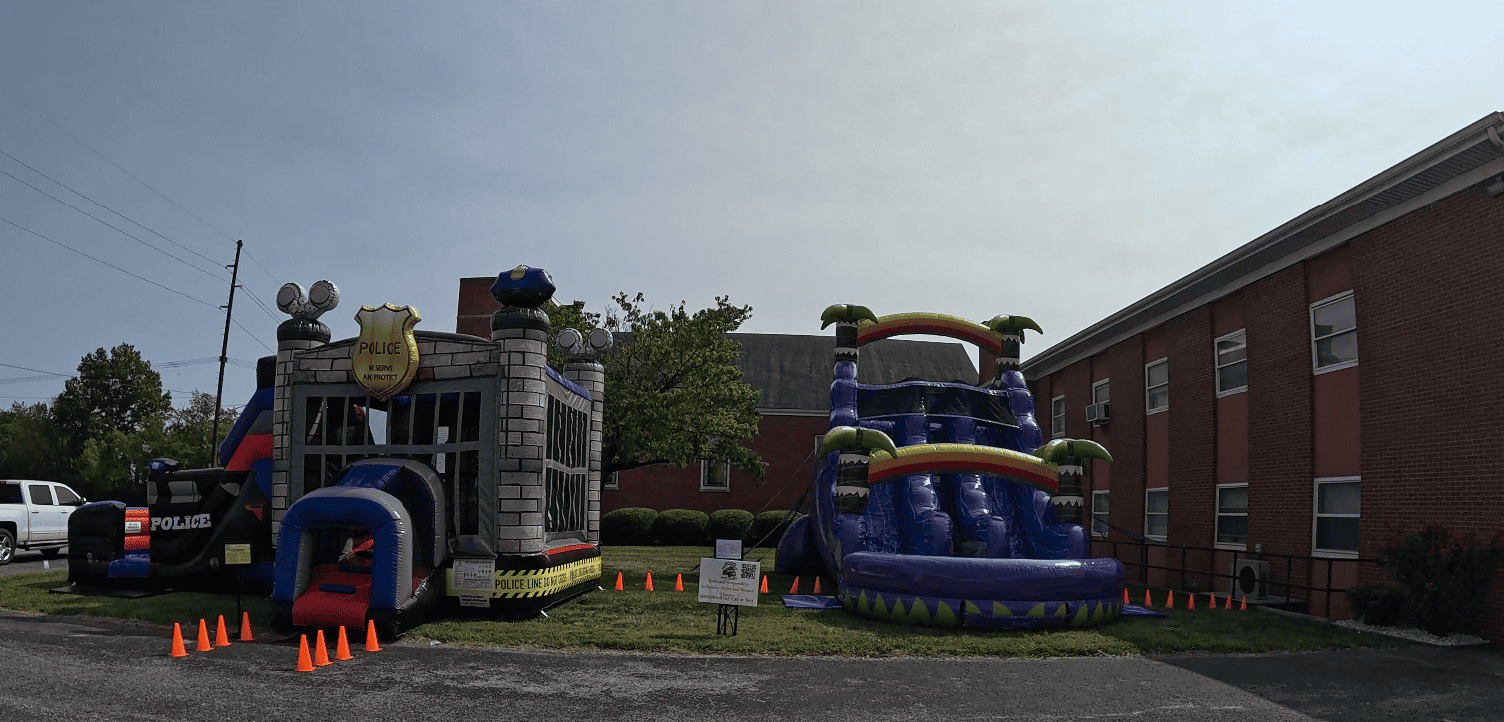 School event rentals featuring inflatable water slides and bounce houses for field days and Project Graduation