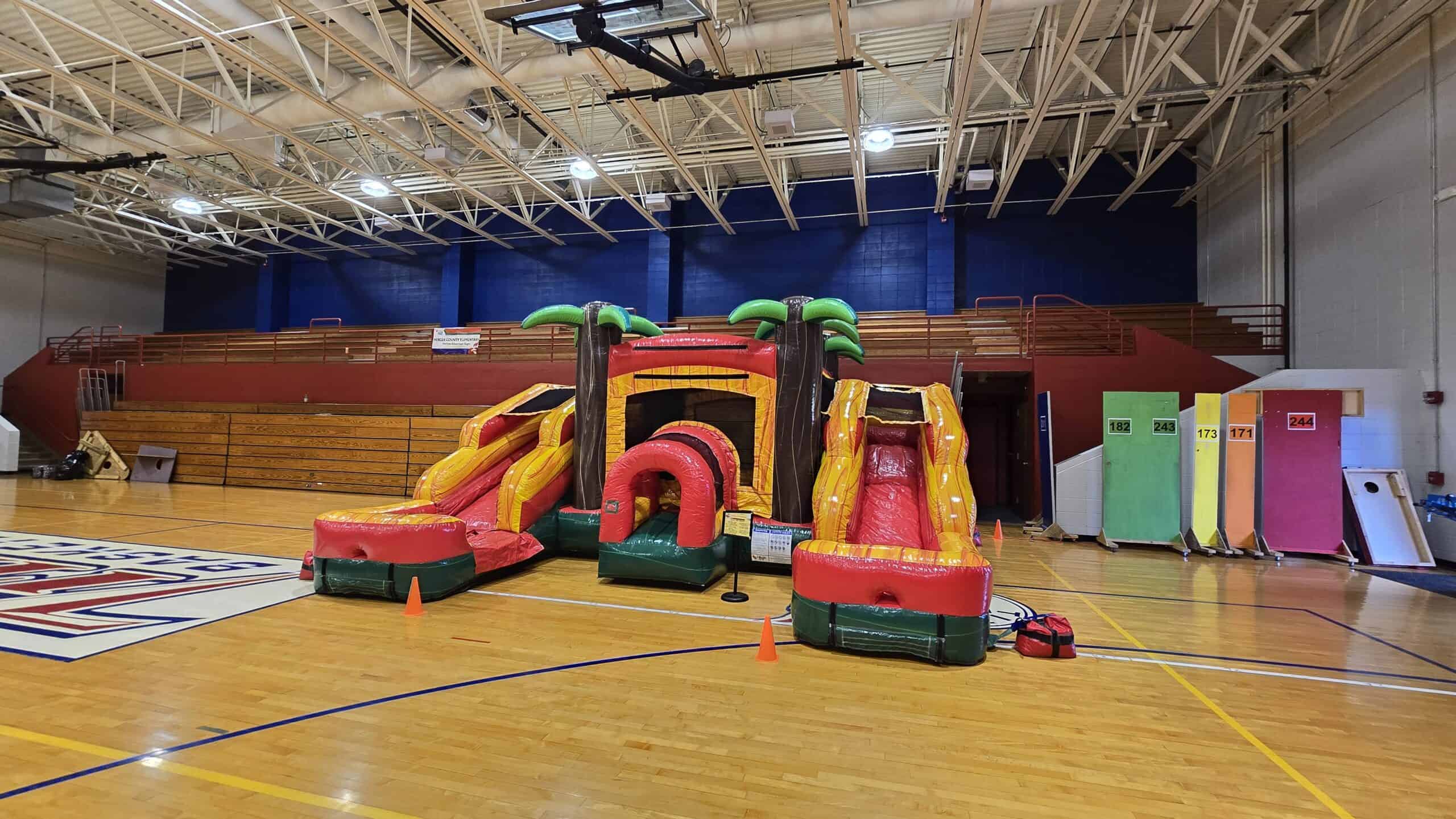 Mini Palm Inflatable bounce house set up inside of a school for a great school event