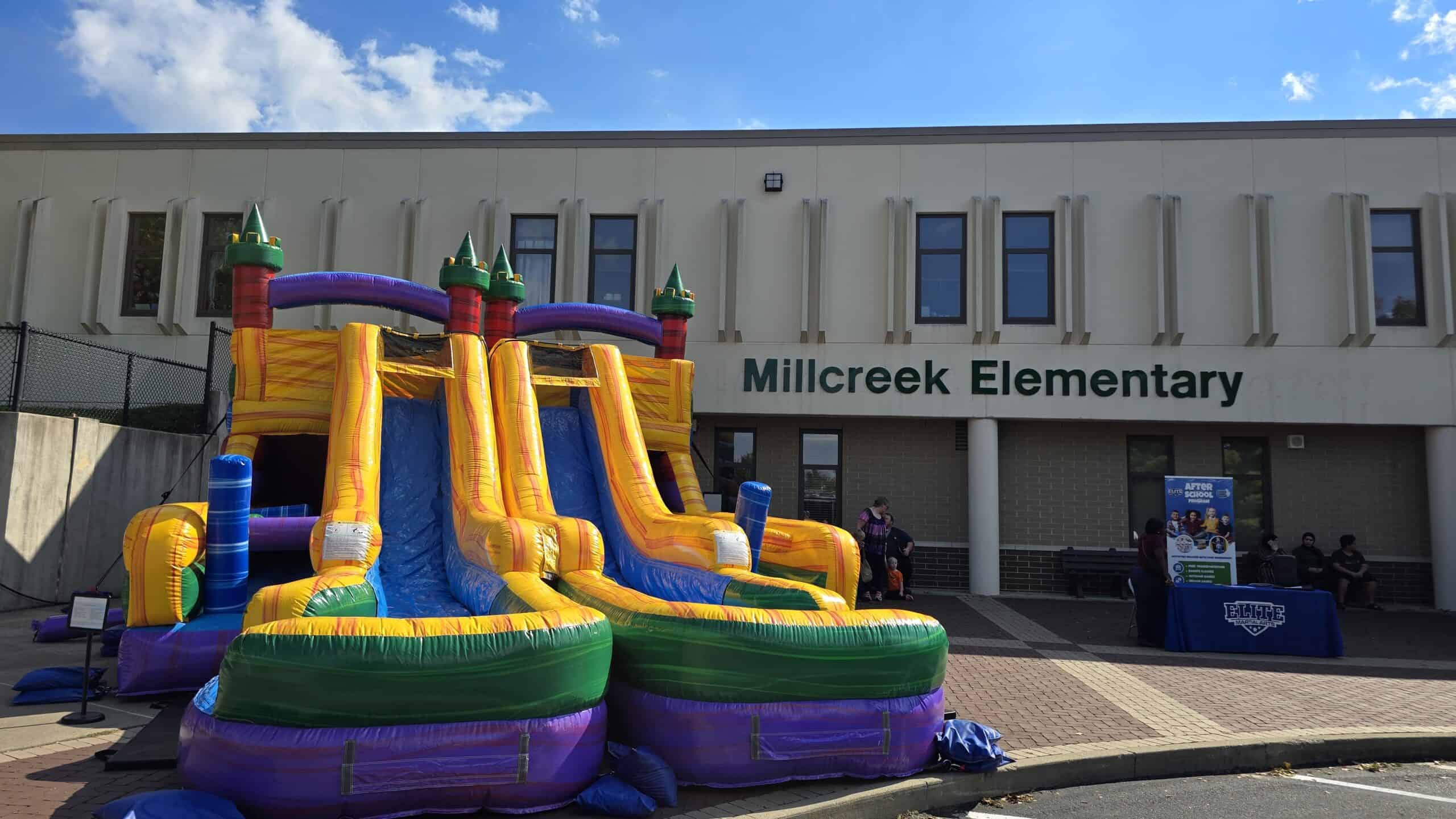School event rentals featuring inflatable water slides and bounce houses for field days and Project Graduation. Did you see the inflatable obstacle course infront of the school