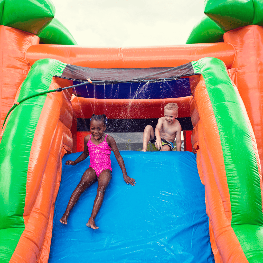 Inflatable water slide rental in Stanford, KY set up for kids at a summer party in Lincoln County