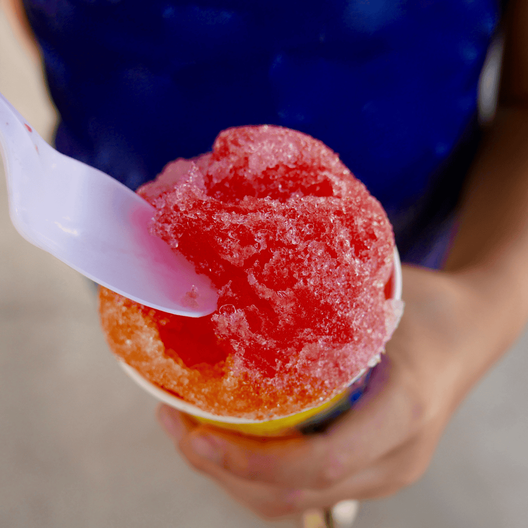 Child enjoying a sno cone from concession rentals at a party in Stanford, Kentucky