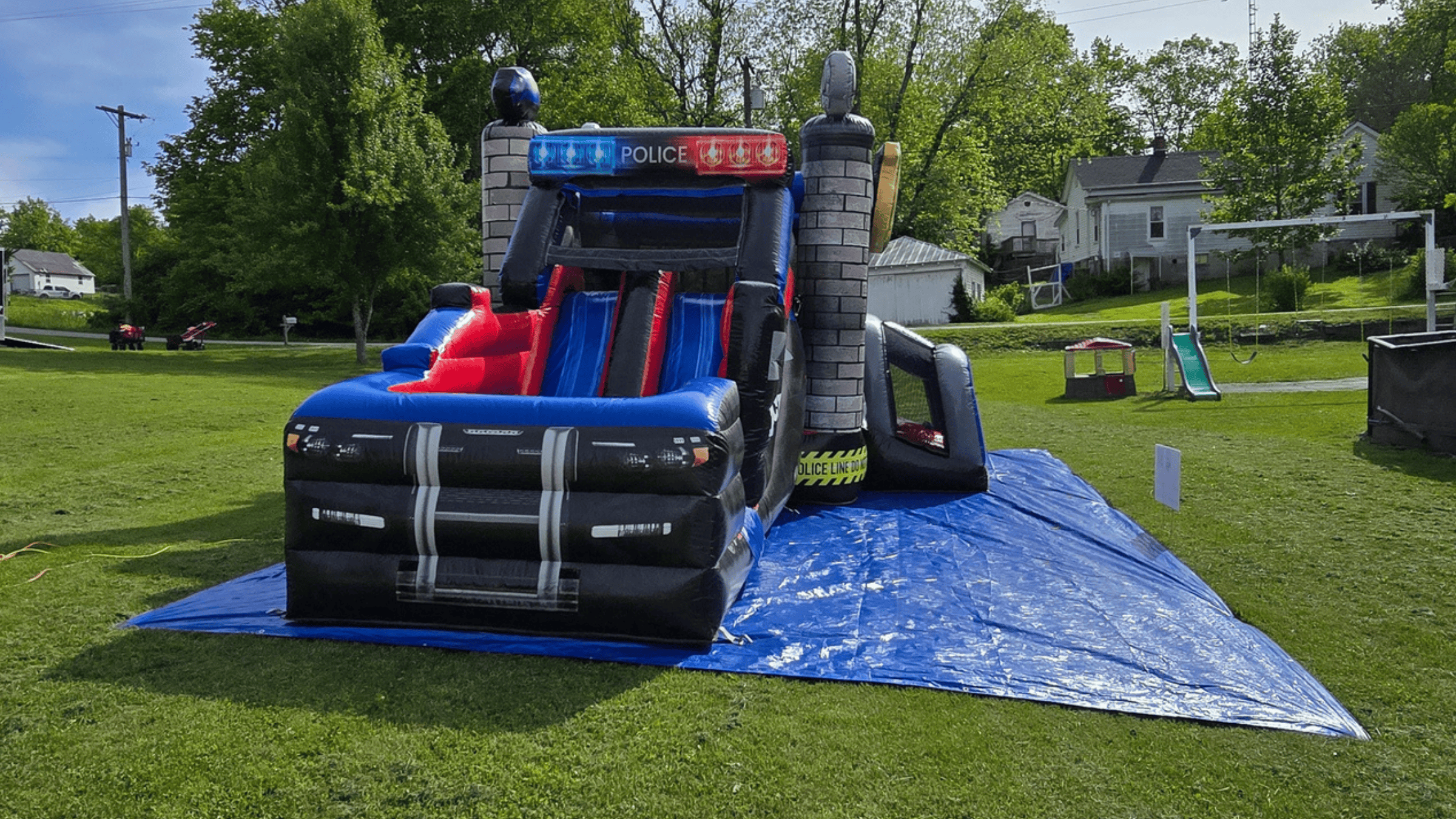 Police Cruiser bounce house side view at a Wilmore / Nicholasville backyard party