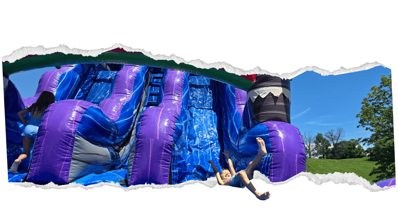 kids going down an amazing inflatable water slide rental in Lexington KY and the surrounding area.