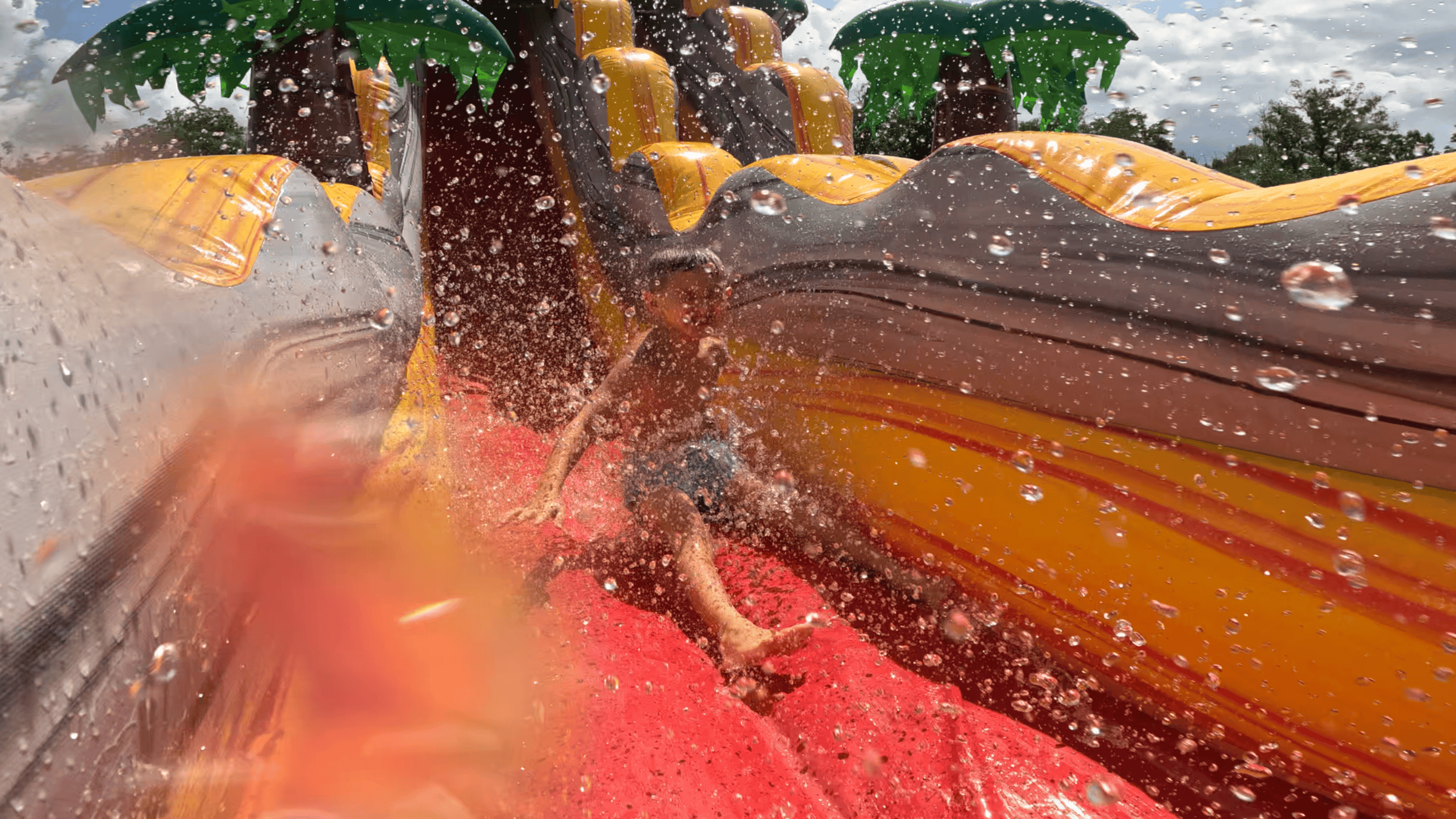 Big splash on the T-Rex water slide — Backyard Responders