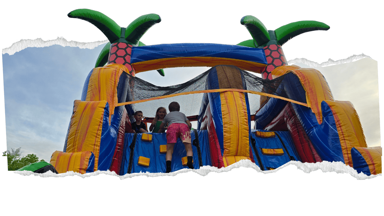 kids climbing the best inflatable obstacle course rental in Central KY